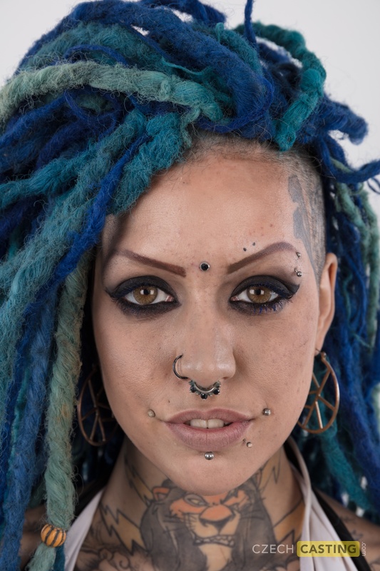 Punk girl with a headful of dyed dreads stands naked in her modelling debut   